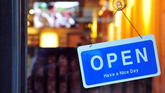 small-business-open-sign-in-window